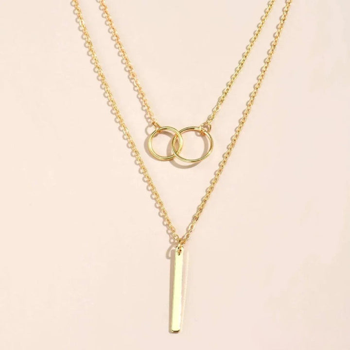 Collier pendentif double cercle rétro doré