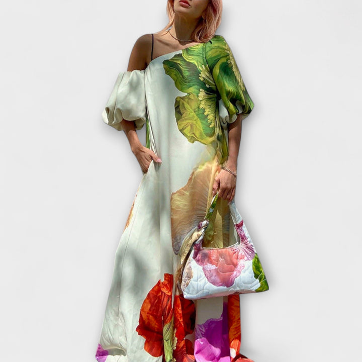 Skylar - Robe longue imprimé floral avec encolure asymétrique et manches bouffantes
