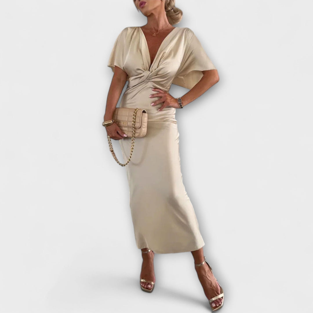 Sable - Robe maxi ajustée en satin uni à col en V avec nœud croisé