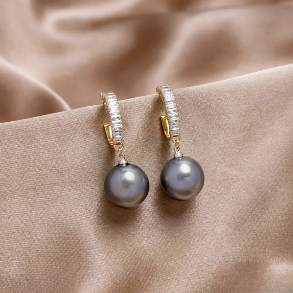 Boucles d'oreilles élégantes avec perles et zirconium