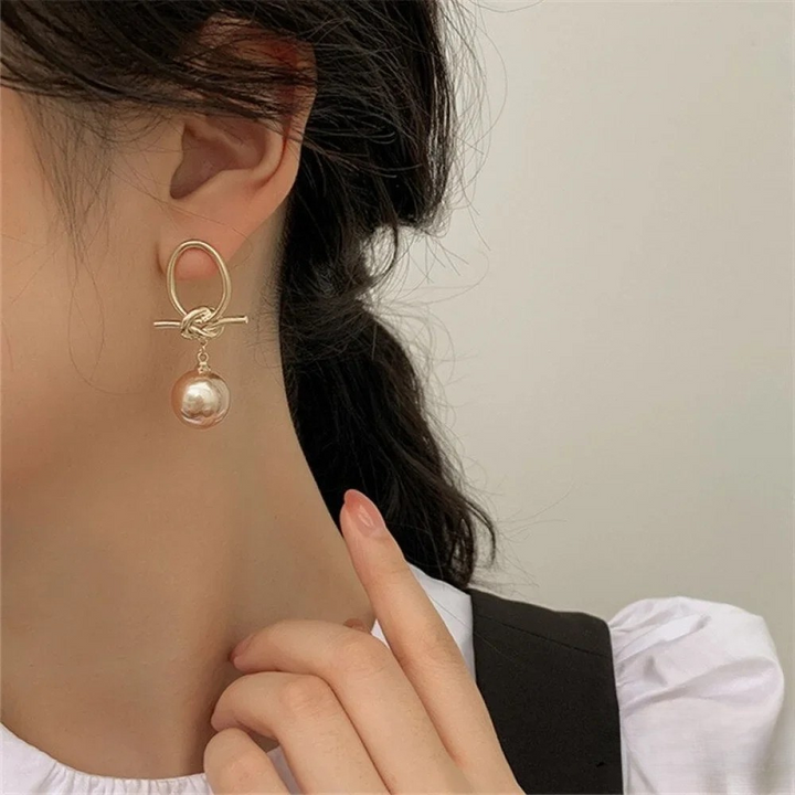 Boucles d'oreilles créoles en perles dorées