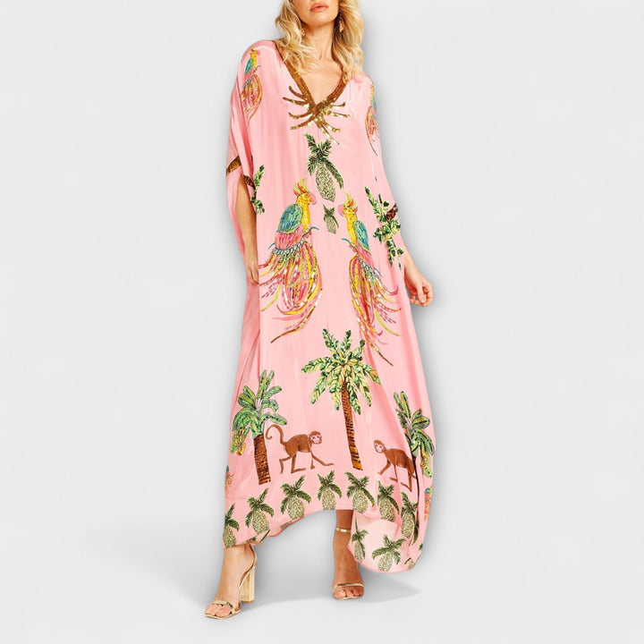 Linda - Robe accroche-regard aux épaules asymétriques et imprimé palmier