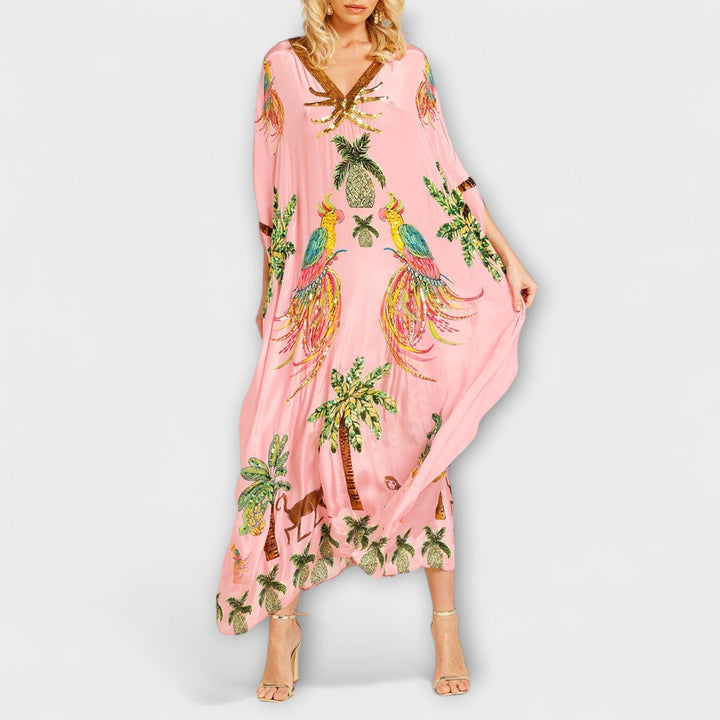 Linda - Robe accroche-regard aux épaules asymétriques et imprimé palmier