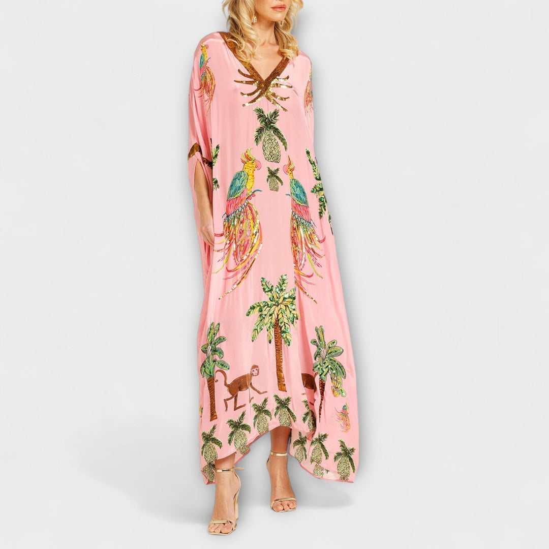 Linda - Robe accroche-regard aux épaules asymétriques et imprimé palmier