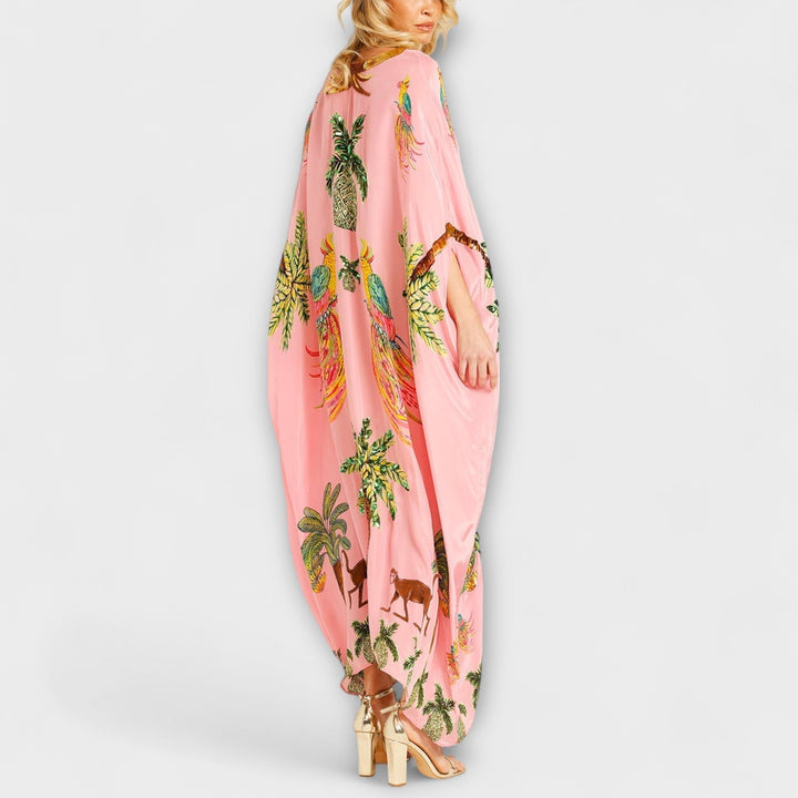 Linda - Robe accroche-regard aux épaules asymétriques et imprimé palmier